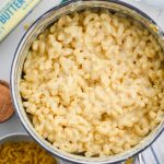 Stovetop mac and cheese in stainless steel pot.