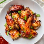 Overhead photo of sweet chili chicken in a white bowl.