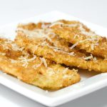 eggplant parmesan chips on white plate.