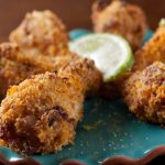 Garlic Lime Chicken Wings on teal plate.