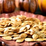 sriracha pumpkin seeds on plate.