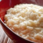 three cheese risotto in red bowl.