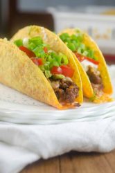 Everyone's favorite party dip turned into a taco! These 7 Layer Baked Chorizo Tacos will be a hit with the whole family!