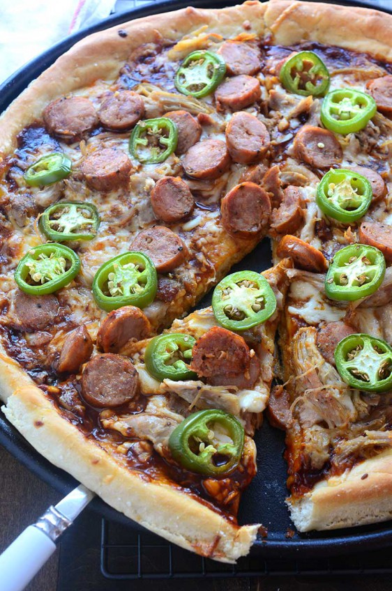 Sweet n' spicy fans will love this pizza! Andouille and BBQ Chicken Pizza is loaded with shredded chicken, andouille sausage, jalapeños and BBQ Sauce.