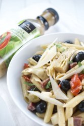 Antipasto Pasta Salad is LOADED with all kinds of goodies like olives, salami, sun dried tomatoes, mozzarella and artichoke hearts. #MySigatureMoments