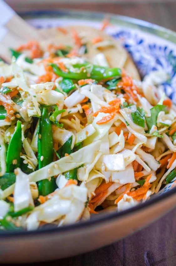 This Asian Cabbage Salad is a quick, easy and refreshing salad with cabbage, snap peas and carrots in a savory ponzu dressing.