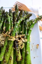 Simple Blistered Asparagus calls for 5 ingredients and is ready in less than 10 minutes. Spring side dish perfection. Gluten free and vegan!