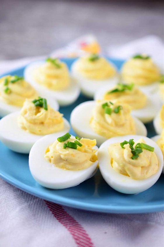 Creamy Asiago Deviled Eggs are a cheesy twist on the classic appetizer. And the perfect way to use up Easter leftovers.