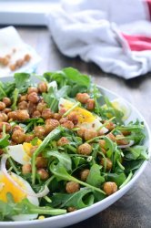 This crispy chickpea and arugula salad is loaded with arugula, crispy fried chickpeas, boiled eggs, shallots and then drizzled with a mustard vinaigrette.