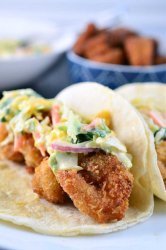 If you are looking for the perfect fried shrimp tacos these are it! These crispy shrimp tacos are loaded with crispy golden fried shrimp and a creamy mango slaw.