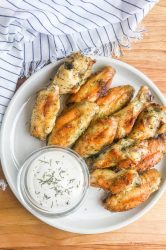 Dill Pickle Chicken Wings will be your new favorite wing! Baked Chicken Wings get a dill pickle twist with pickle brine. The whole family will love these easy baked chicken wings. 