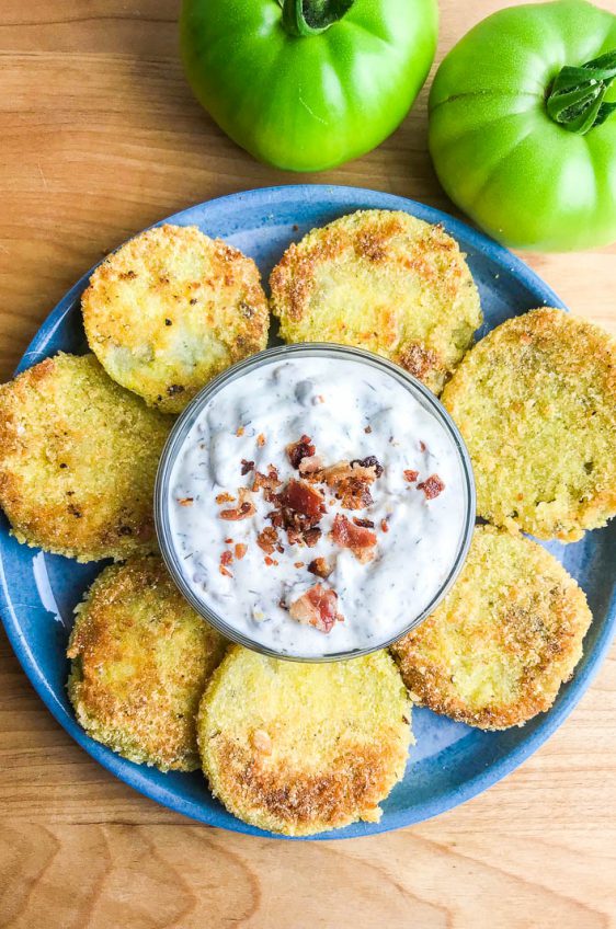 Fried green tomatoes are a classic southern dish, and this fried green tomatoes recipe kicks up the flavor, adding a bacon ranch dipping sauce to them!