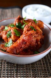 Harissa chicken wings are a twist on the classic game day eats! Chicken wings baked to perfection and tossed in a harissa butter sauce.