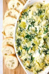 Decadent Hot Crab Spinach Artichoke Dip is a must for parties this season! If you love spinach artichoke dip, you will love this version with crab! 