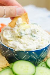 Creamy Artichoke Jalapeño Dip is a summer potluck must! Loaded with two cheeses, artichokes and jalapeños, it's impossible to resist. 