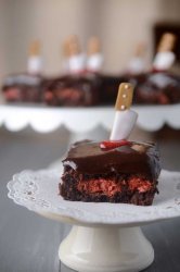 Killer Fudge Brownies are stuffed with Three Musketeers, topped with a layer of decadent chocolate ganache and a little Halloween flare. Perfect for parties