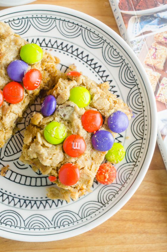 Easy and chewy Monster Cookie Bars are a perfect afternoon treat for kiddos! Change out the colors of the M&Ms for all of your favorite holidays!