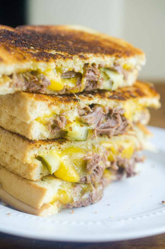 Pot Roast Grilled Cheese is THE BEST thing to do with your leftover Pot Roast. Loaded with cheddar, pot roast and pickles. It's leftover bliss!