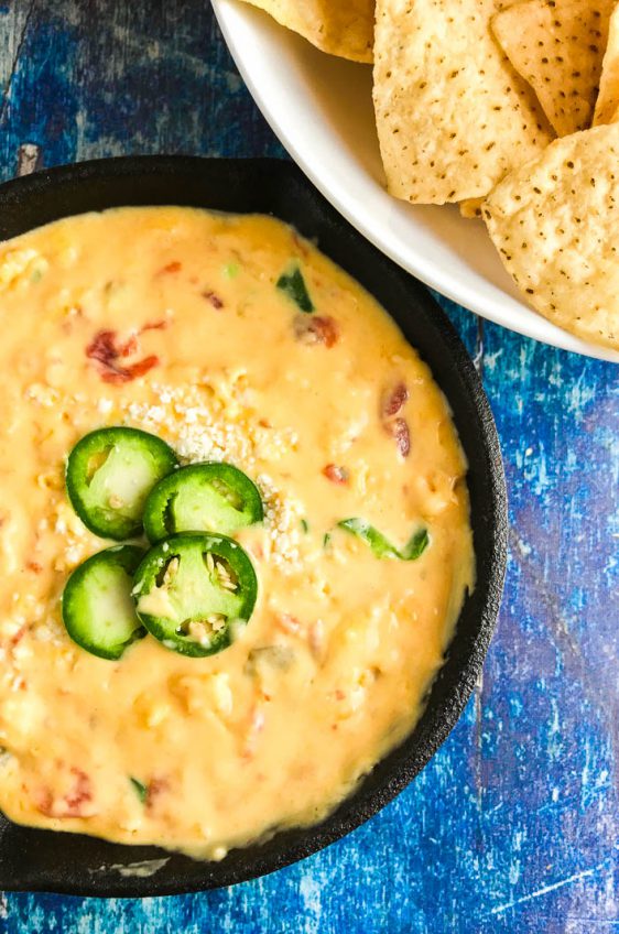 Queso Dip with Three Cheeses is a must for all of your tailgating, parties, summer BBQs. With Velveeta, pepper jack and cotija it's a creamy, cheese dip sure to be a hit