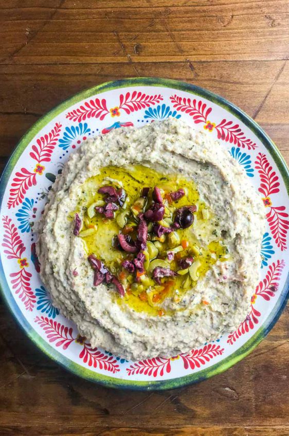 Quick olive hummus is a great twist on the classic snack. It's the perfect dip for parties or your afternoon snack session. 