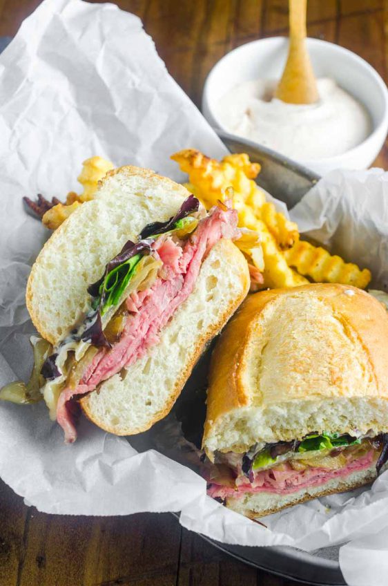 The Best Roast Beef Sandwich loaded with thinly sliced roast beef, caramelized onions, lettuce and a creamy horseradish sauce.