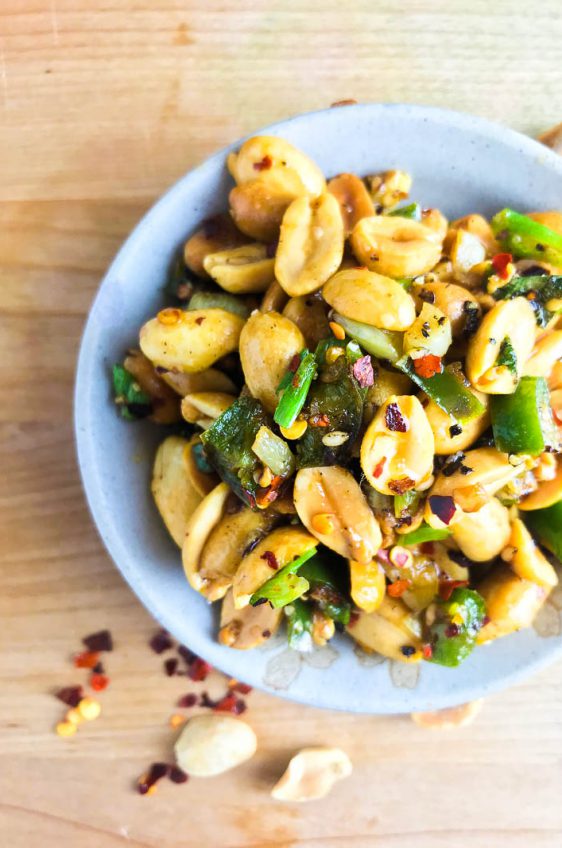Spicy Fried Peanuts are your new favorite snack! These peanuts are fried in hot oil, sesame oil, garlic, Serrano peppers and crushed red peppers. A little heat and a whole lot of flavor! 