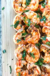 Spicy Grilled Shrimp is the perfect recipe to add a little kick to your next BBQ. With only 3 ingredients and less than 10 minutes on the grill, they are ready in a flash too! 