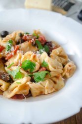 Tortellini Puttanesca is loaded with tomatoes, olives, capers, garlic and red wine. It is a family hit that will make weeknight dinners a breeze!