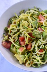 Zucchini Noodles Salad. A fresh zucchini noodle salad with tomatoes, zucchini, and avocado tossed in a lemon basil vinaigrette. Perfect for summer!
