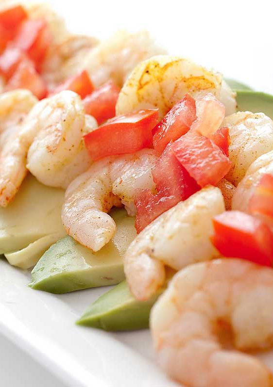 Adobo Shrimp on a bed of sliced avocado, topped with tomatoes and a squirt of lime. Quick, easy and a reminder that summer is just around the corner. 