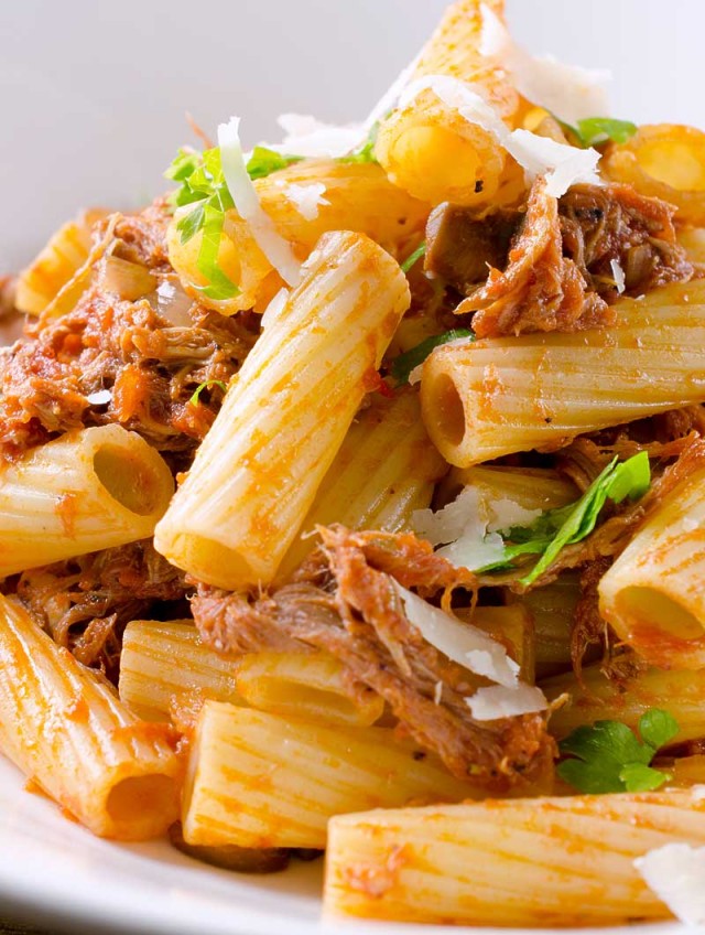 Pulled Pork Rigatoni is the best way to use leftover pulled pork. Pasta tossed with crushed tomatoes, pulled pork, onions, mushrooms and garlic.