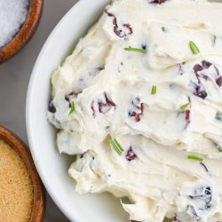 Cranberry cream cheese in white bowl.