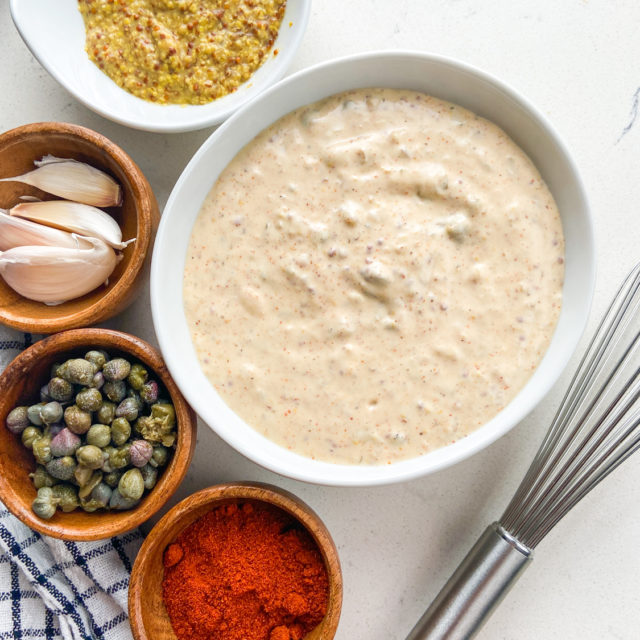 Overhead photo of remoulade sauce in a white bowl.