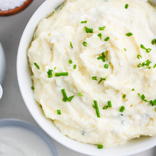 Horseradish mashed potatoes in a white bowl.