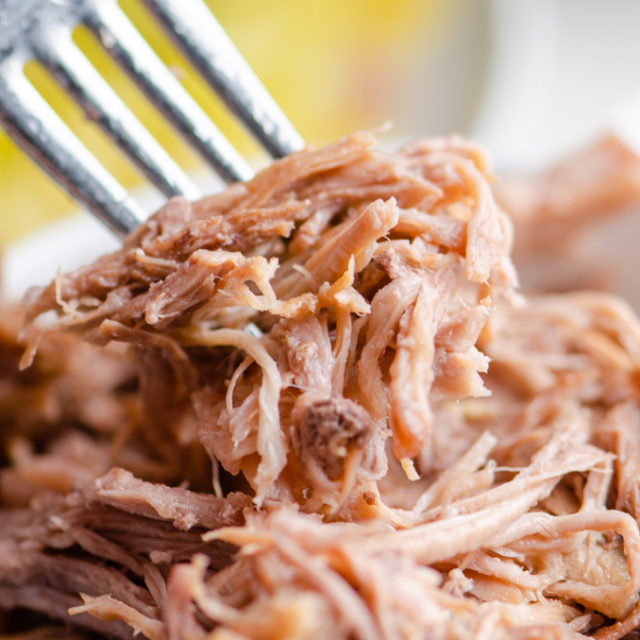 Instant pot kalua pork on a fork.