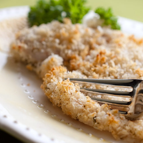 baked garlic cod on plate.