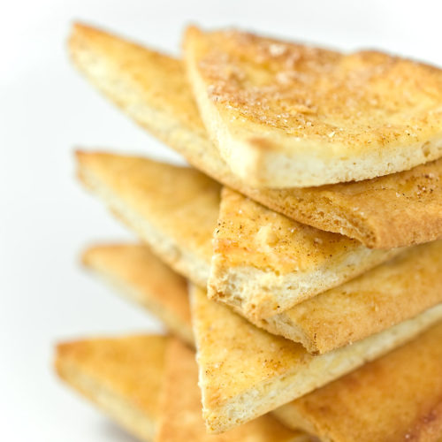 Close up of stacked baked pita chips