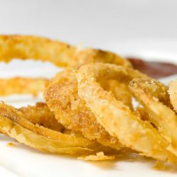 buttermilk walla walla onion rings on white plate.