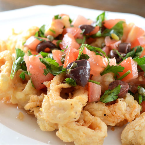 calamari puttanesca on plate.