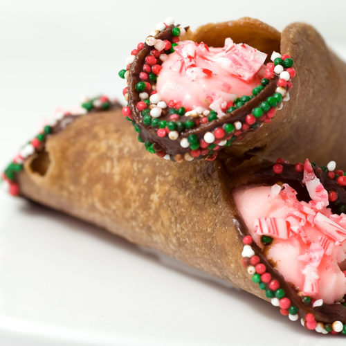 2 peppermint filled cannoli on white plate.