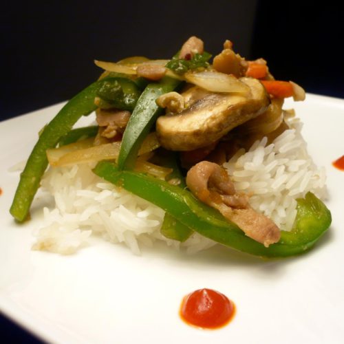 Spicy chicken teriyaki on white plate.