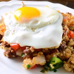 Chorizo fried quinoa with fried egg on top.