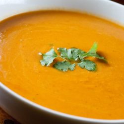 curry pumpkin soup in white bowl.
