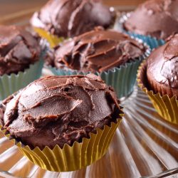 Dairy free chocolate cupcakes on plate.