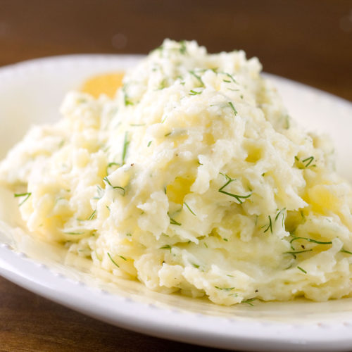 dill mashed potatoes on plate.