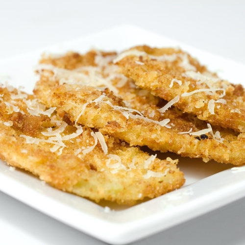 eggplant parmesan chips on white plate.