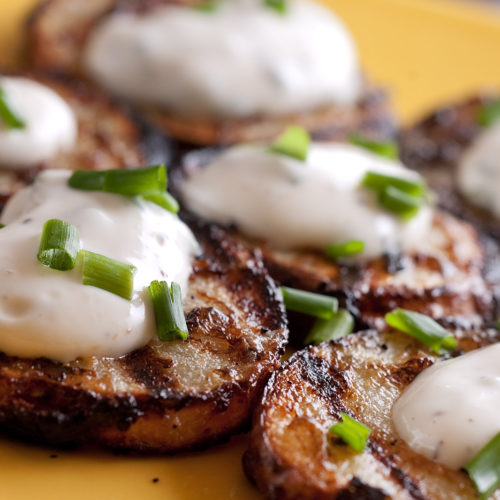 Grilled Potatoes with Chive Sauce on plate.