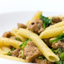 Penne with sausage, spinach and arugula