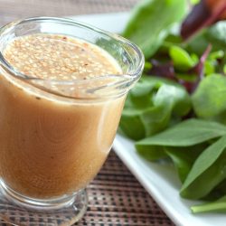 sesame vinaigrette in a small glass cup.