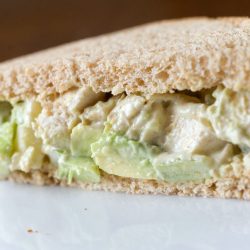 spicy chicken salad sandwich on a plate.